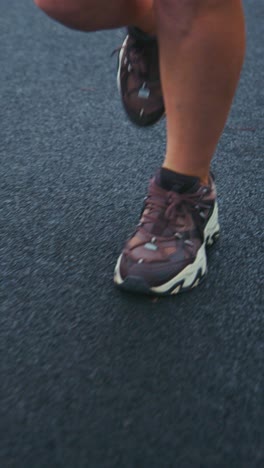 a close-up view of stylish athletic footwear on a running track highlighting comfort, design, and movement in modern sports fashion