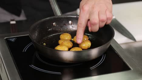 chef frying potatoes