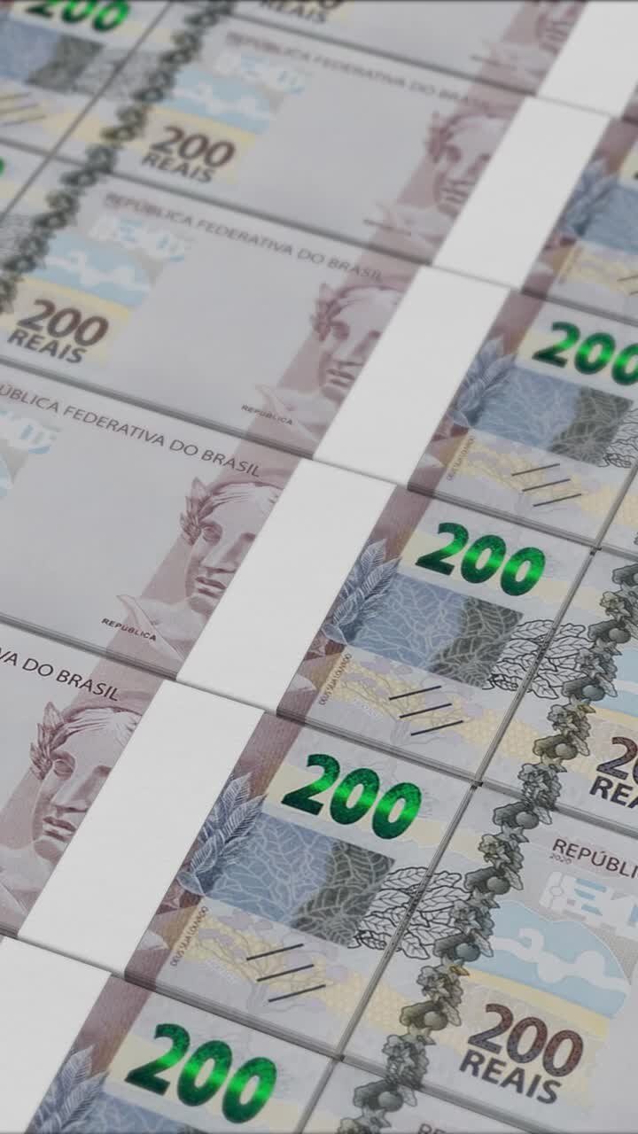 Vertical video of 200 BRAZILIAN REAL banknotes printing by a money press