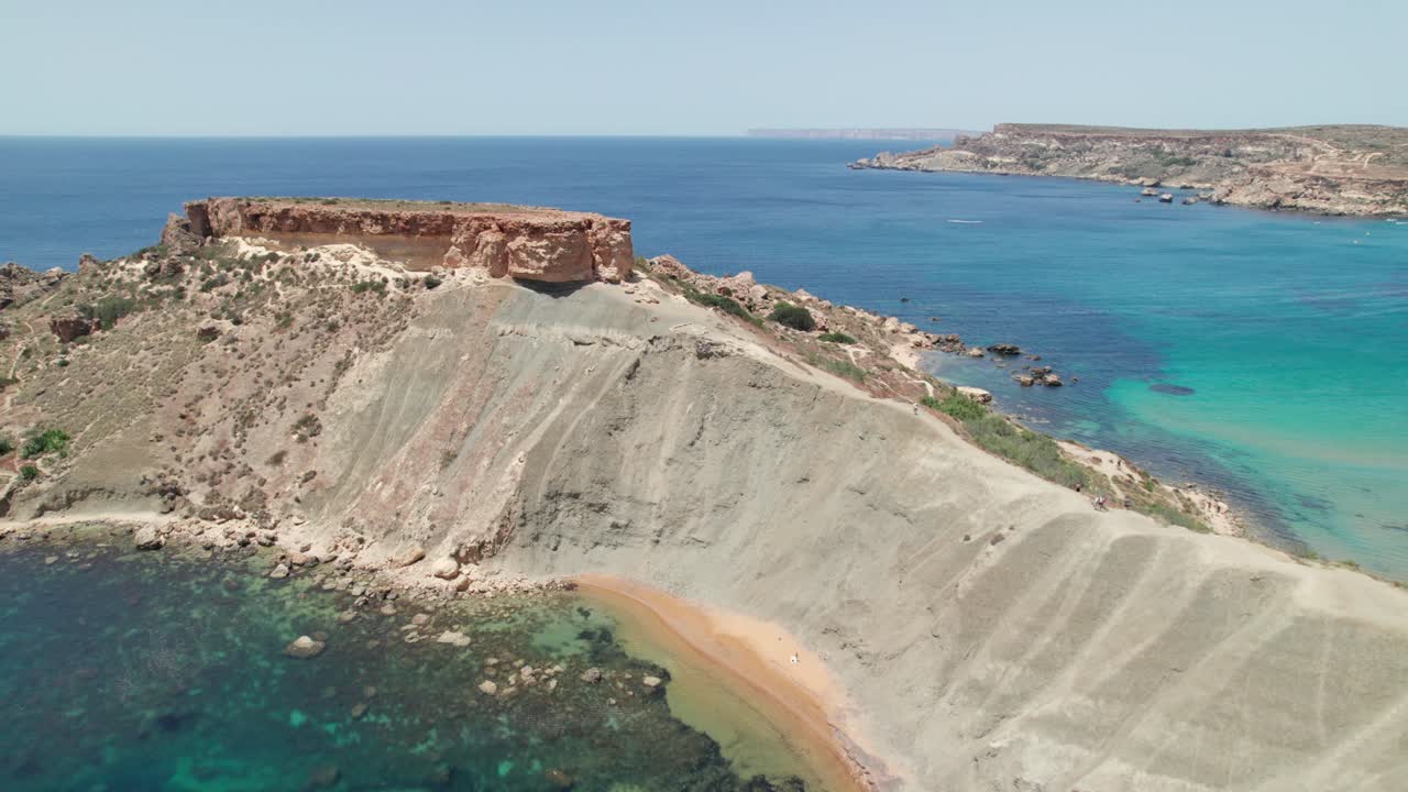 Rocky cliffs and turquoise Mediterranean Sea. Aerial view of Malta island