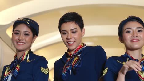 cabin crew dancing with joy in airplane