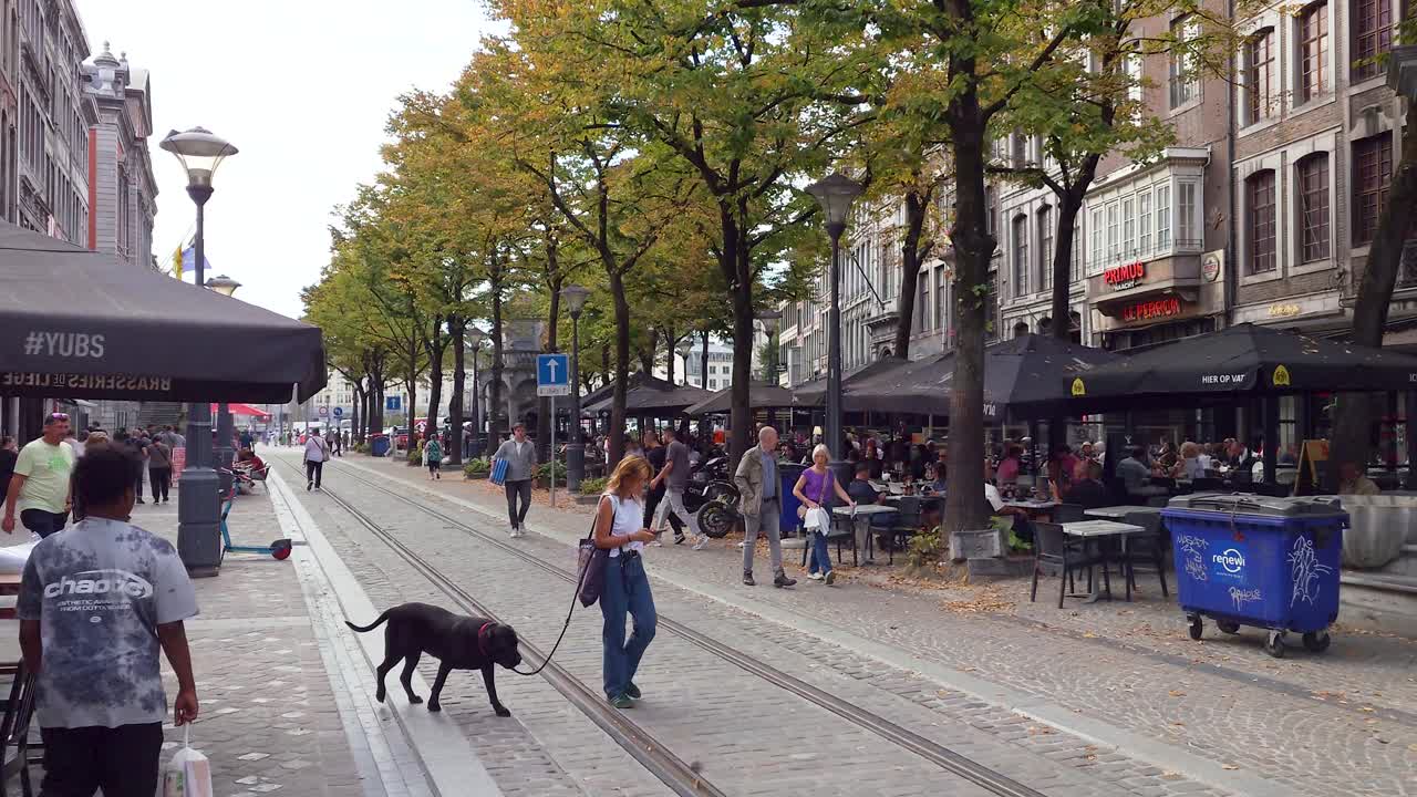 People walking at the Place du Marché square in the city center of Liège, Belgium