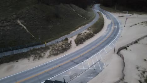 a truck parked along the coast during winter storm