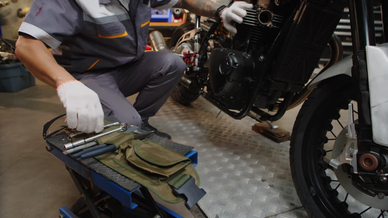 Repairing Center Specialist Fixing Broken Motorbike