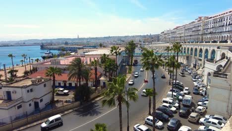 shot of the sea front road of algiers with fishing port in the background algeria