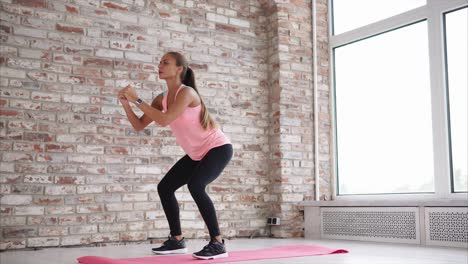 woman performing squats