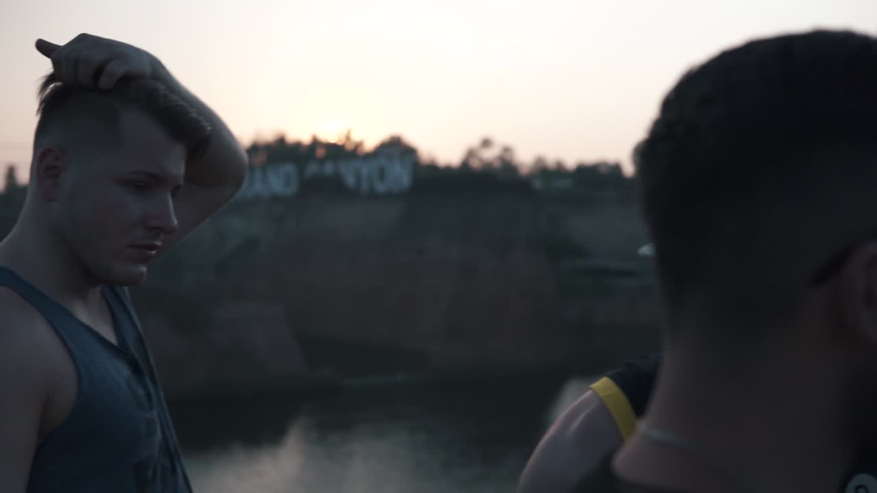 Man holding drone controller showing to his friends, slow motion POV shot