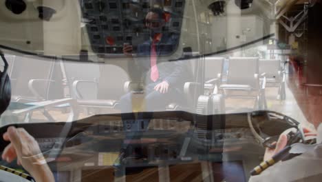 video compuesto de dos pilotos masculinos en la cabina sobre hombres de negocios afroamericanos que usan teléfonos inteligentes