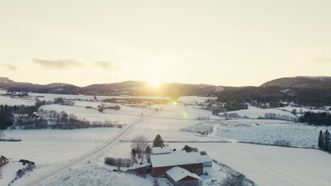 dazzling sun shining over the snowy landscape and norwegian town during winter