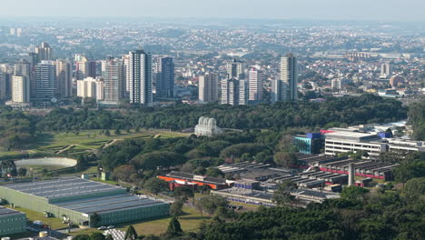 slow forward aerial movement to the central sports field and city park about the botanical garden of curitiba, paraná, brazil