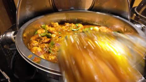 shrimp curry in a heated buffet dish