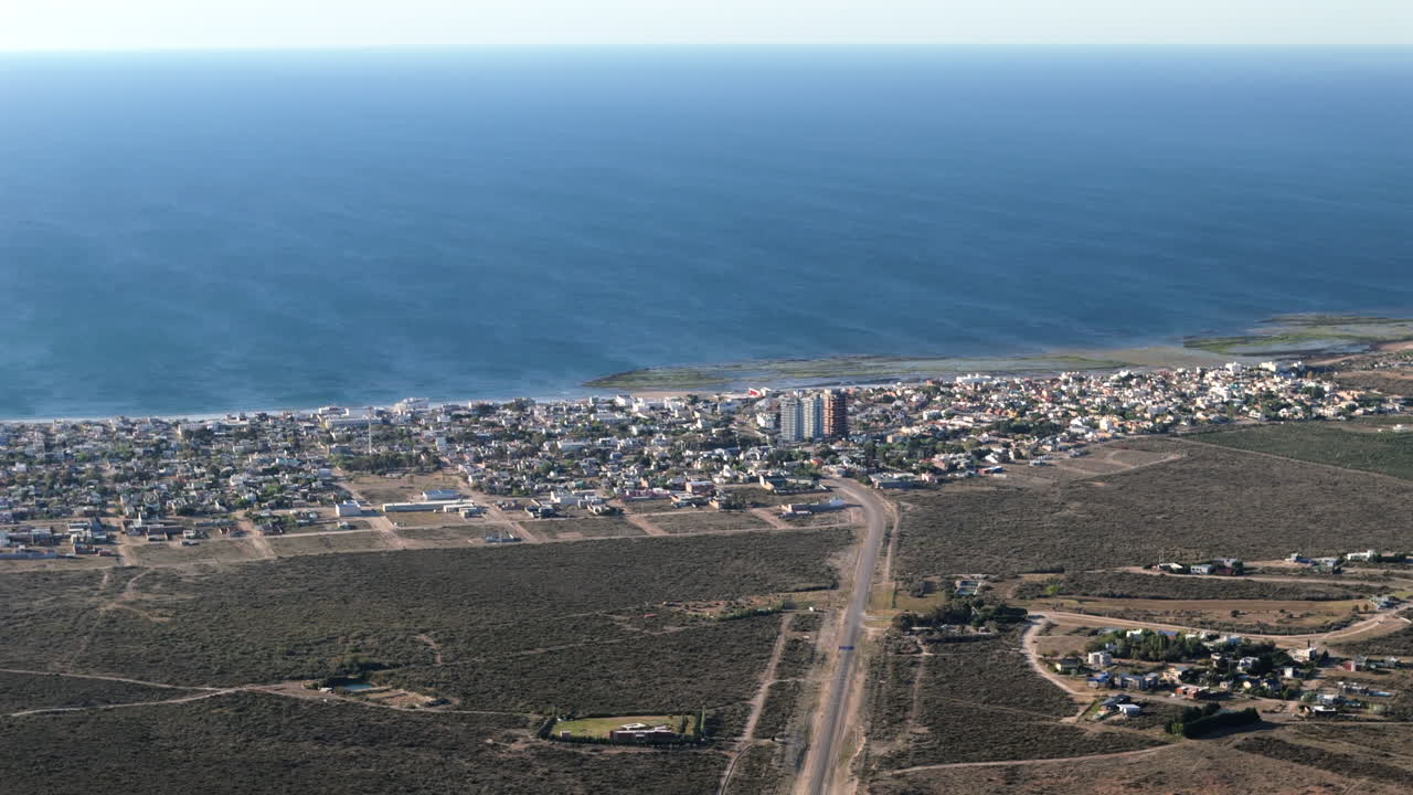 Establishing drone shot of Las Grutas cityscape in Patagonia in the day, Argentina