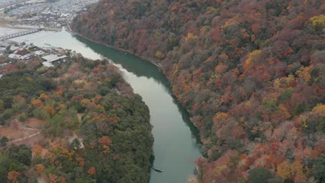 katsura river winding to arashiyama and togetsu-kyo bridge in autumn colors, kyoto japan 4k