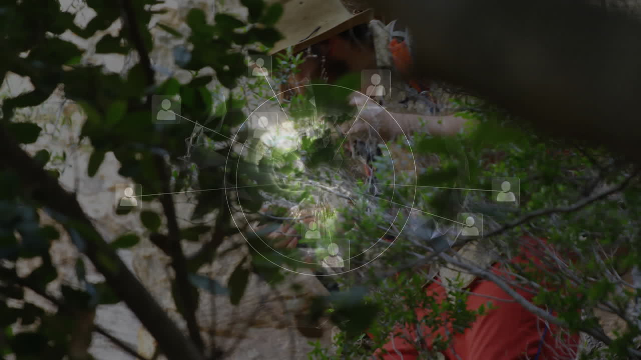 Male climber scaling rocky cliffside, showing tech network overlay with connecting profile icons