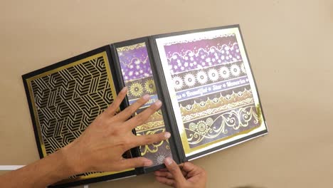 decorating cover of lever arch file binder with ornate foil papers