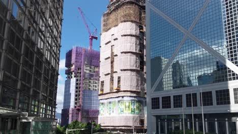 skyscraper under construction in central financial district, hong kong china