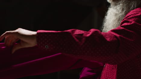 man in red shirt with white beard