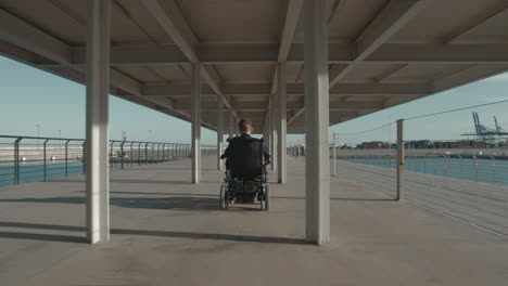 handicapped child in wheelchair on waterfront