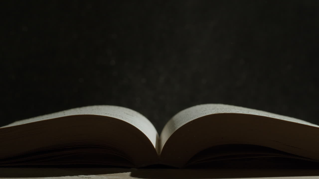 Open Book with Water Droplets