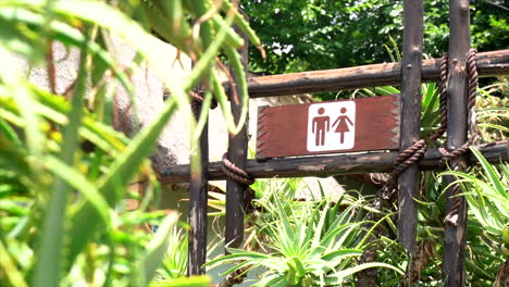 male and female restroom signage, slow panning shot left to right