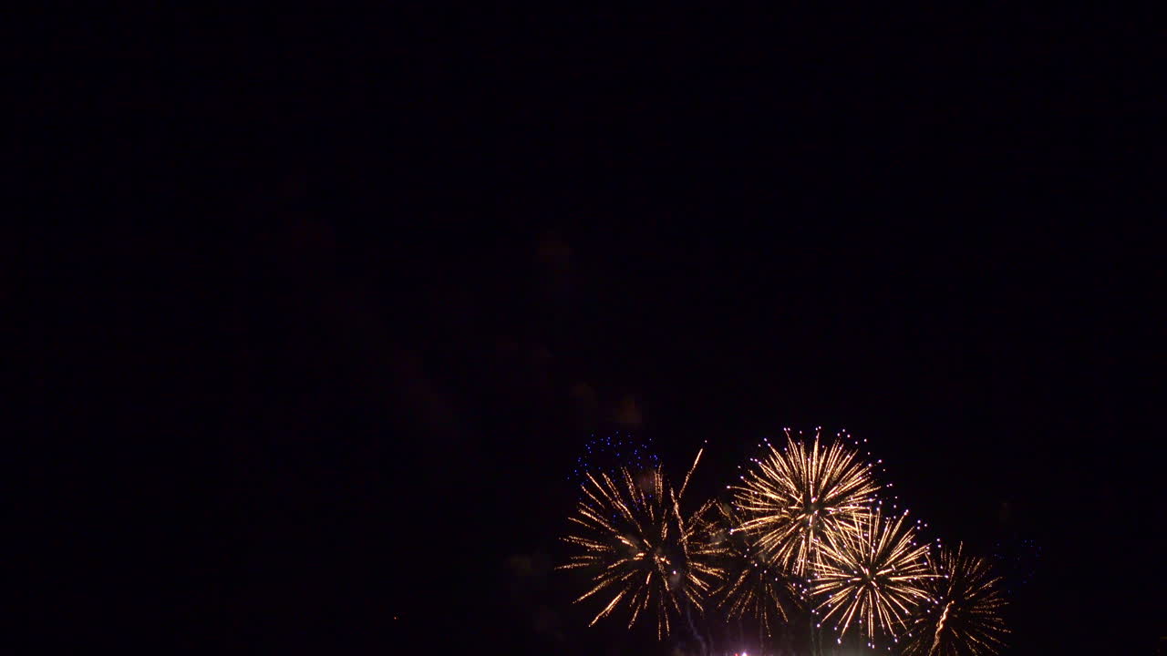 Beautiful abstract colourful Fireworks explode display on sky at night a symbol of celebration in New years anniversary for background