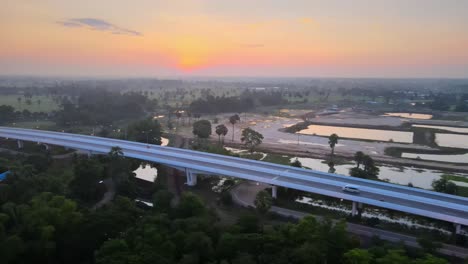 aerial view of a highway at sunrise