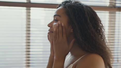 woman applying face cream