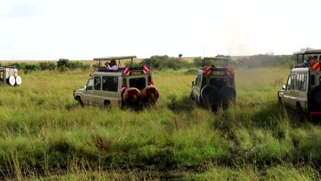 4x4 car stucked in the mud and safari tourists in cars