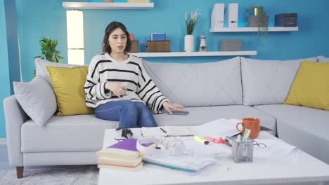 the woman tidying up the mess. it tidies up the work environment.