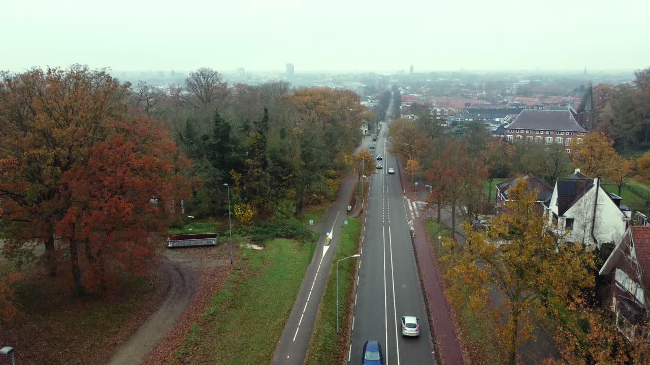 Cityscape with Road and Autumn Foliage