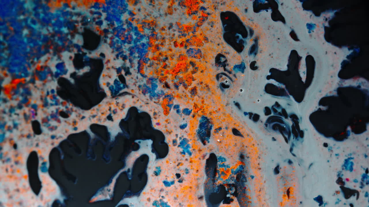 Colorful ink abstract macro close-up, swirling liquid texture with vibrant hues