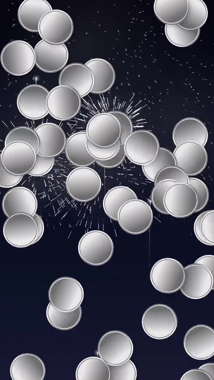 Abstract silver discs float and burst against a dark night sky with sparkling firework effects.