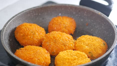 fried fish cakes in a pan