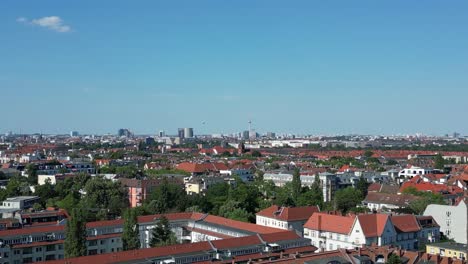 Stunning-aerial-top-view-flight-Bell-tower-Lukas-church-city-Berlin-steglitz,-Germany-Summer-day-2023