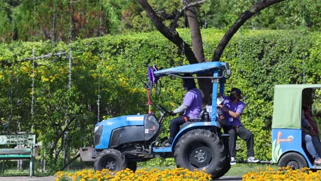 tractor in a park with people