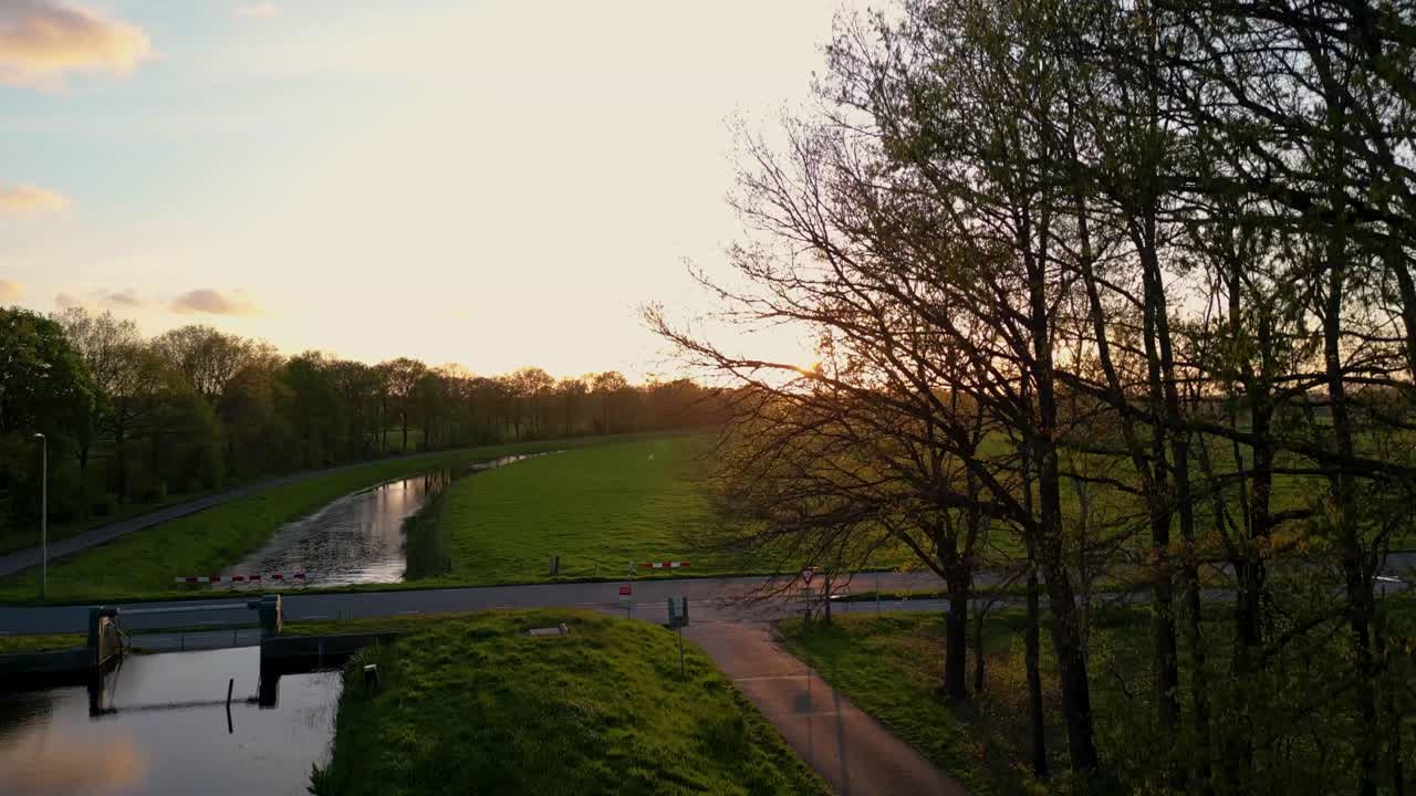 Sunset over Dutch Canal and Fields