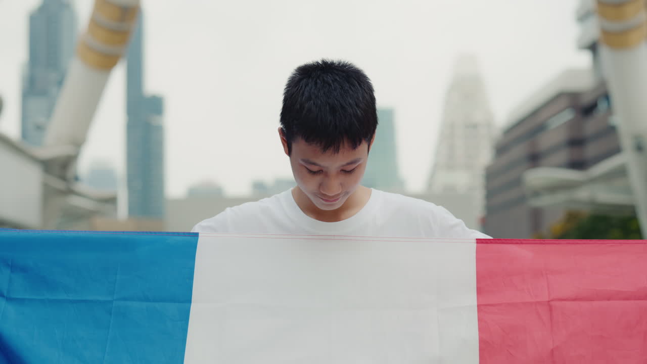 A person holding a flag of France