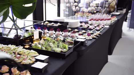 professional catering during modern event cheese cake pudding on black tablecloth shoot on gimbal slider