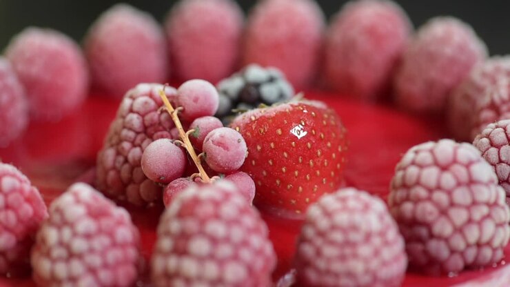 Cake with strawberries and berries on turntable