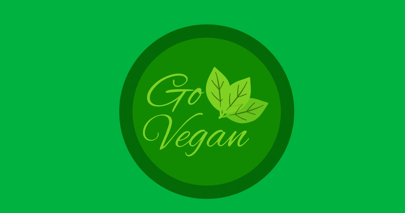 Digital animation of go vegan text with leaves icon over a green round banner on black background