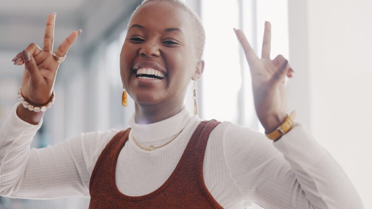 Business, fun and female worker with hand gesture