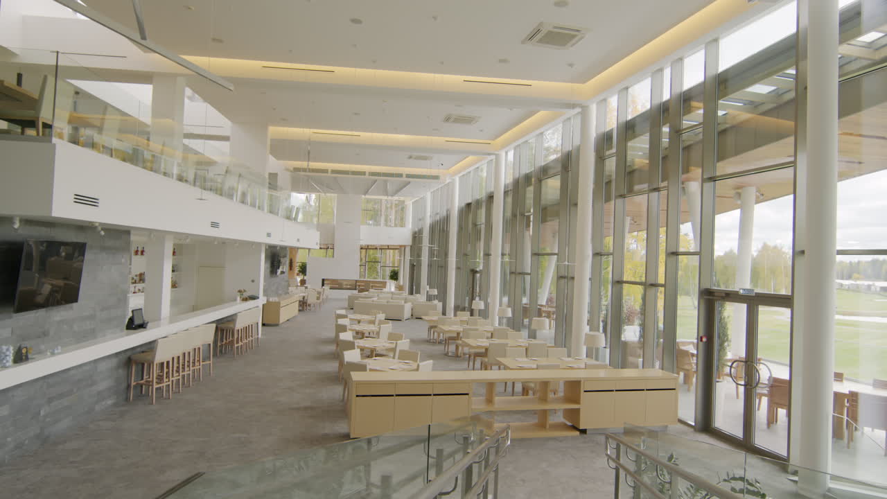 Spacious Modern Restaurant Interior with Bar and Large Glass Walls