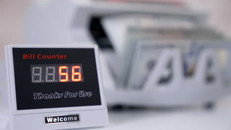 automatic mechanism for bank financial operations. electronic equipment shows the amount of money on the device during counting paper banknotes.