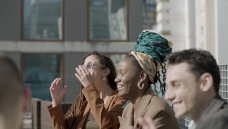 medium shot of happy business partners laughing together outdoor