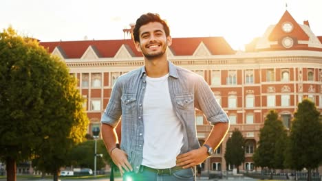 smiling man in front of building