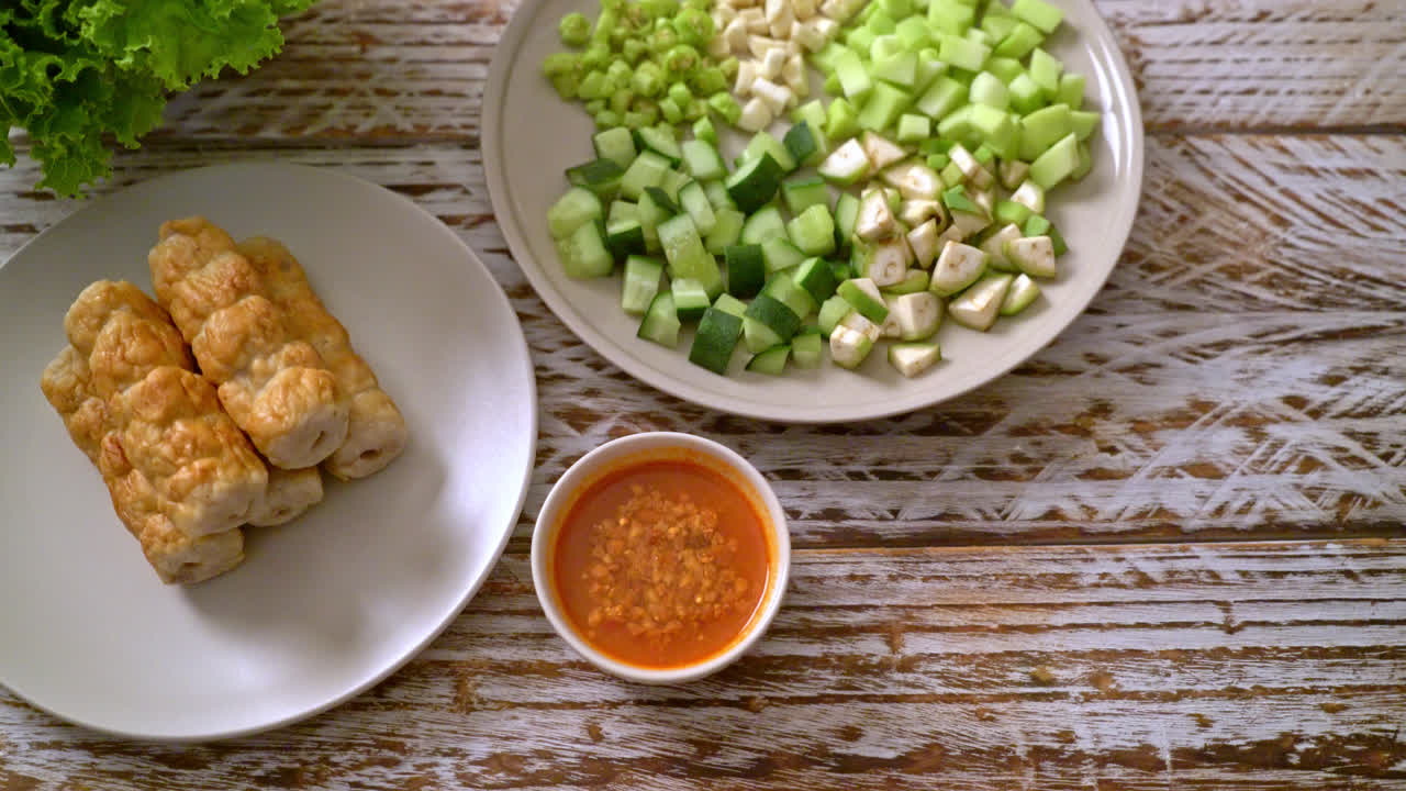 Vietnamese pork meatball with vegetables wraps (Nam-Neaung or Nham Due) - vietnamese traditional food culture