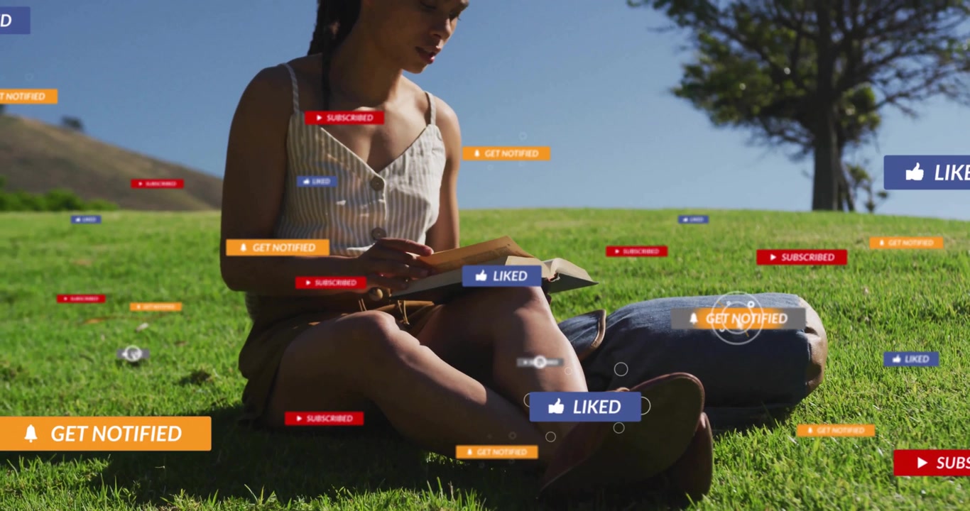 Woman reading book on grass watching cursor clicking like icons managing social notifications