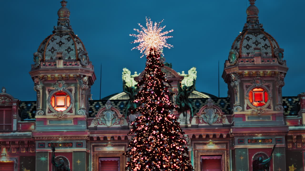 Monte Carlo , Monaco -December 23, 2024: Lighted Christmas tree in front of the Monte Carlo Casino in the evening