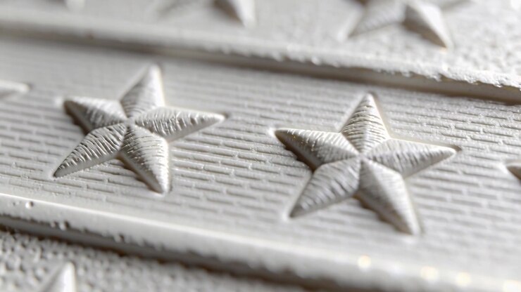 Shifting camera revealing embossed five-pointed stars on panel band for closeup study, highlights