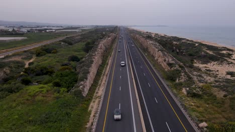 The-highway-and-railway-at-Moshav-Megadim-near-the-outskirts-of-Haifa,-Northern-Israel